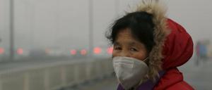 In Peking sind Atemmasken derzeit kaum mehr wegzudenken. 
