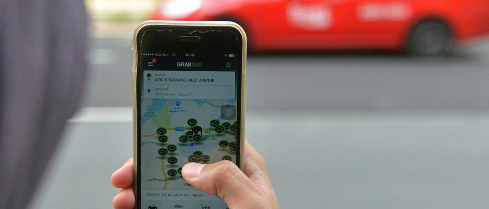 Online-Dienstleister wie GrabTaxi vermitteln zwischen Taxianbietern und Kunden.
