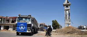 Hilfe in größter Not: Ein Konvoi der Vereinten Nationen bringt Lebensmittel zu Bedürftigen in Syrien.