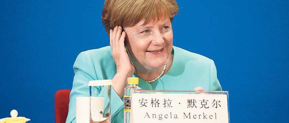 Angela Merkel in China: Wirtschaftliche Interessen und politische Wunschvorstellungen prallen aufeinander.
