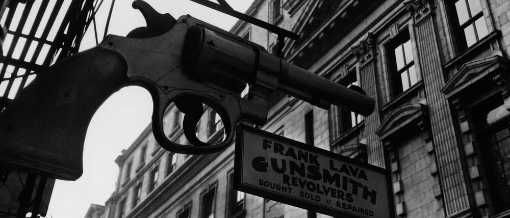 Berenice Abbott, Gunsmith and Police Department 6 Centre Market Place and 240 Centre Street, Manhattan, 1937.