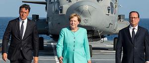 Die richtige Symbolik? Merkel, Renzi und Hollande am Montag auf dem Flugzeugträger "Garibaldi".