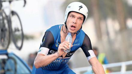 Siegerschluck. Beim Teamzeitfahren gewann Martin mit dem Etixx-Rennstall Gold. Nun soll es auch im Einzel klappen. Foto: Imago/Belga