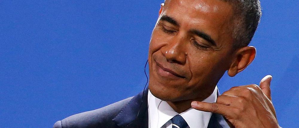 Bei Fragen gern anrufen! US-Präsident Obama während der Pressekonferenz mit Kanzlerin Merkel.