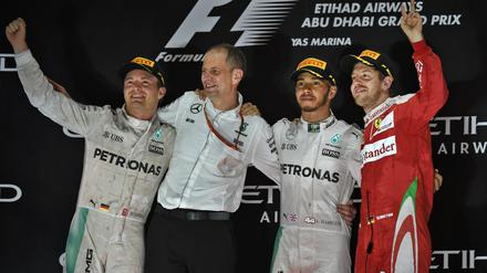 Glücksgefälle. Nico Rosberg, Tony Ross, Lewis Hamilton und Sebastian Vettel.