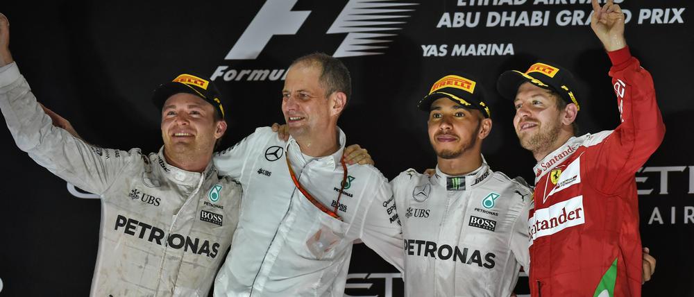 Glücksgefälle. Nico Rosberg, Tony Ross, Lewis Hamilton und Sebastian Vettel. 