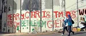 Botschaft. „Frohe Weihnachten aus dem Ghetto Bethlehem“ steht an der israelischen Sperranlage in der heiligen Stadt.