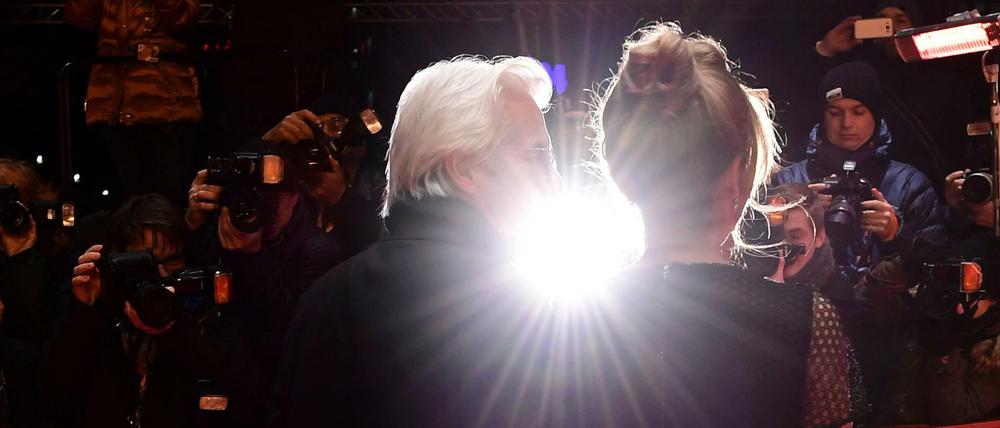 US actor Richard Gere and Alejandra Silva pose as they arrive on the red carpet for the premiere of the film "The Dinner" in competition during the 67th Berlinale film festival in Berlin on February 10, 2017. / AFP PHOTO / Tobias SCHWARZ