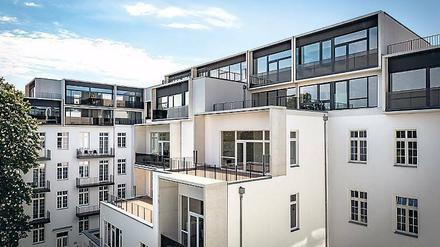Paragon Apartments. Das Dach wurde vom Altbau abgenommen und durch zwei neue Stockwerke ersetzt.
