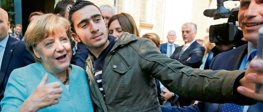 Ein Foto, ein Verhängnis: Der Syrer Anas Modamani beim Selfie mit der Kanzlerin. 
