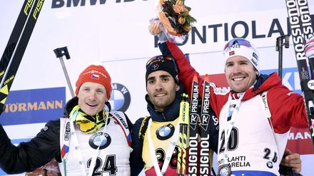 Martin Fourcade (Mitte) feierte seinen 60. Sieg im Weltcup.