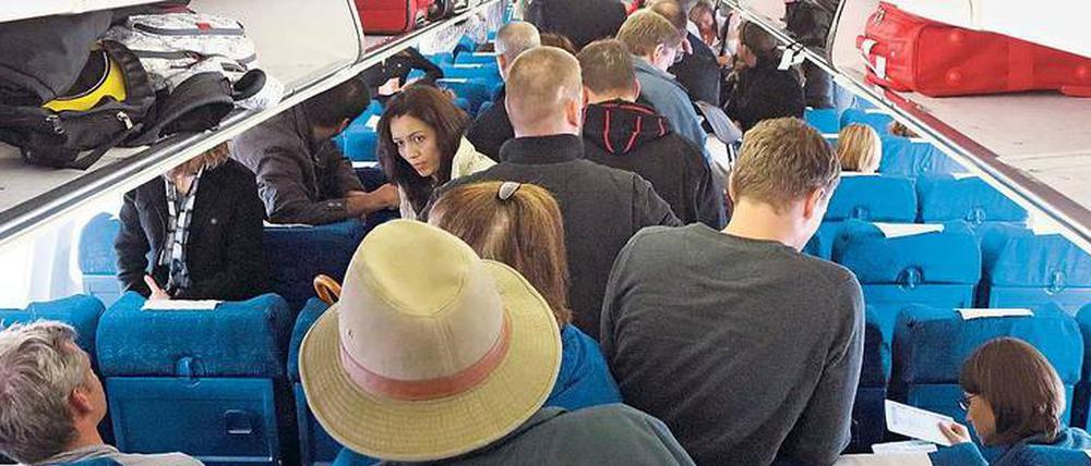Volle Maschine. Wer seinen Sitzplatz im Flugzeug abgibt, sollte nicht jedes Kompensationsangebot annehmen. 