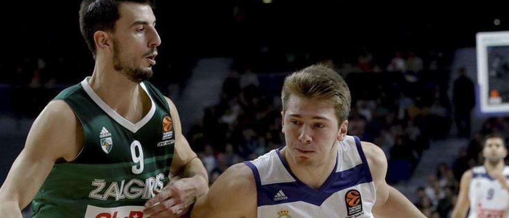 Luka Doncic (r.) will mit Real den Titel.