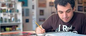 Beseelt von Trickfilmen. Autist Owen Suskind beim Zeichnen.