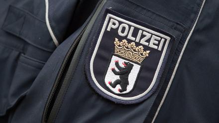 Wappen der Berliner Polizei. Die will in Zukunft besser bezahlt werden.