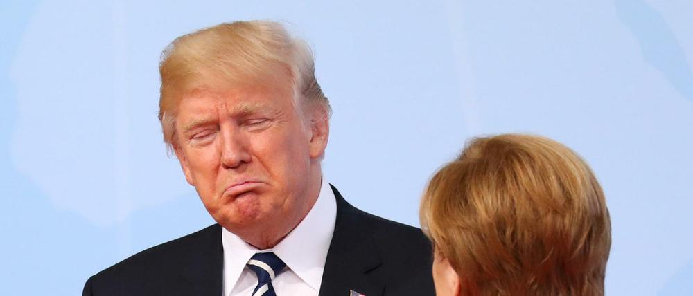 Bundeskanzlerin Angela Merkel begrüßt Donald Trump. Gerne würden die G20-Staaten mit ihm über Klimapolitik reden.