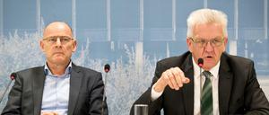 Im Bundesland von Winfried Kretschmann (r) und Winfried Hermann (beide Grüne) ist mit Daimler einer der bedeutendsten Autokonzerne zu Hause. 