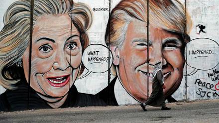 Graffiti-Porträts von Hillary Clinton und Donald Trump im Westjordanland. 