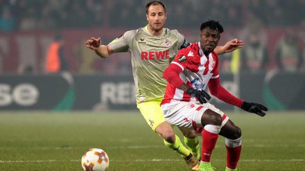 Matthias Lehmann (l.) und der 1. FC Köln fliegen gegen Richmond Boakye und Roter Stern Belgrad aus dem Wettbewerb.