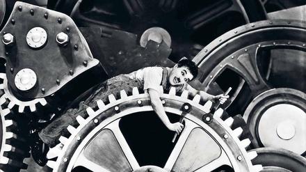 Charlie Chaplin in seinem Film „Moderne Zeiten“ von 1936.