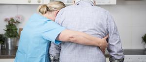 Gereatric nurse supporting week patient