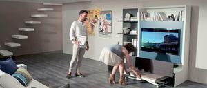 Die Schrankwand "Smart Living" von Ozzio hat ein cleveres Versteck: In der Lade verbirgt sich ein Klapptisch.