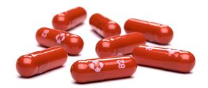 This October 18, 2021 handout photo courtesy of Merck & Co,Inc. shows capsules of the antiviral pill Molnupiravir. - Britain on November 4, 2021, approved the use of Merck's antiviral pill to treat patients suffering from mild to moderate Covid-19, the Medicines and Healthcare products Regulatory Agency (MHRA) announced. "Today is a historic day for our country, as the UK is now the first country in the world to approve an antiviral that can be taken at home for Covid-19," said health minister Sajid Javid. Molnupiravir, works by decreasing the ability of a virus to replicate, thereby slowing down the disease. (Photo by Handout / Merck & Co,Inc. / AFP) / RESTRICTED TO EDITORIAL USE - MANDATORY CREDIT "AFP PHOTO /Merck & Co,Inc./HANDOUT" - NO MARKETING - NO ADVERTISING CAMPAIGNS - DISTRIBUTED AS A SERVICE TO CLIENTS