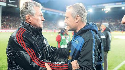 Respekt. Bayerns Coach Jupp Heynckes (l.) lobte Christian Streich. 