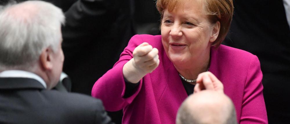 Die drei Koalitionäre sind mit dem Erreichten sichtlich zufrieden.