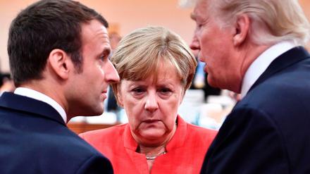 Frankreichs Präsident Macron, Kanzlerin Merkel und US-Präsident Trump (v.l.n.r.) im vergangenen Juli beim G-20-Gipfel in Hamburg.