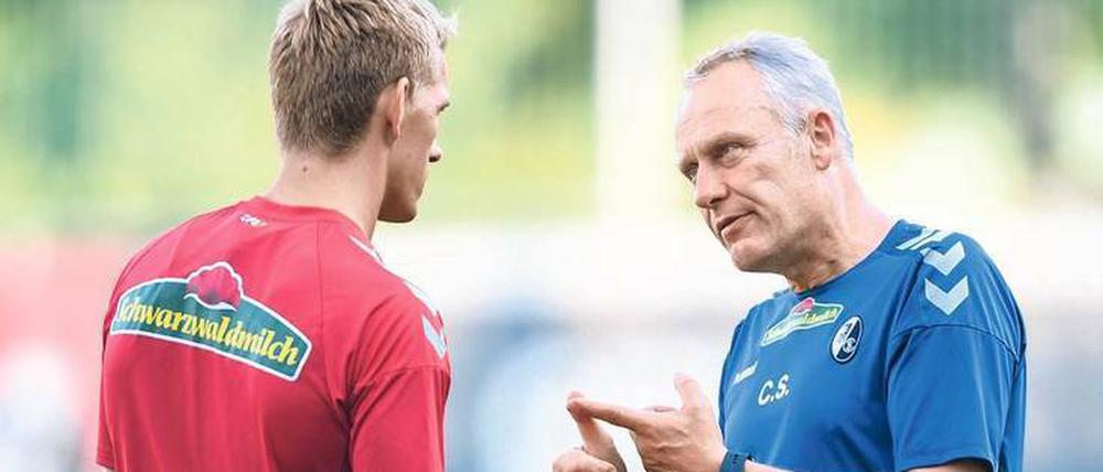 Die Torgefahr in Person. Nils Petersen (l.) mit Freiburgs Trainer Christian Streich.