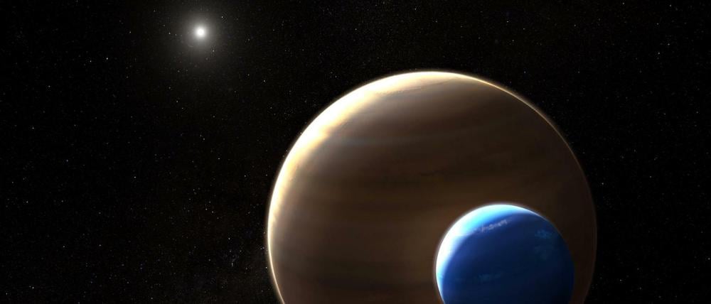 Die Illustration eines Künstlers zeigt den Planeten Keppler-1625b und seinen Mond in einem fremden Sonnensystem.