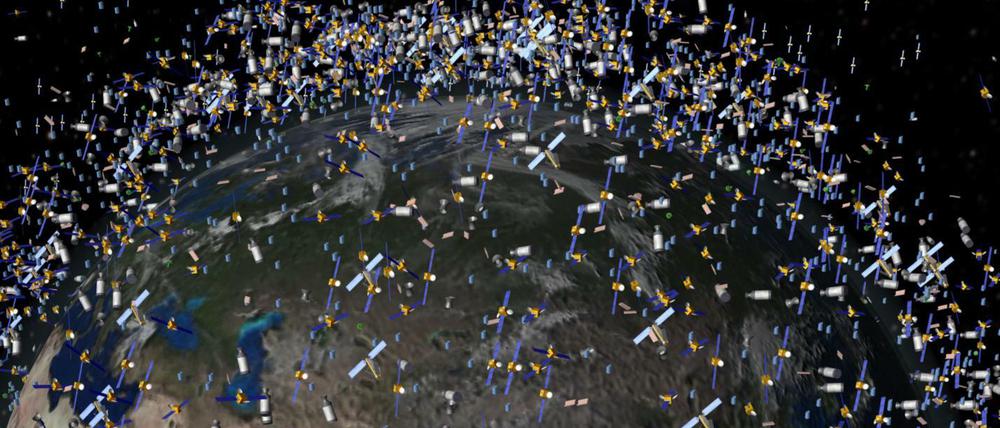  Das computergenerierte Bild der European Space Agency (ESA) zeigt Weltraummüll früherer Weltraummissionen, der neben intakten Satelliten um die Erde kreist. 