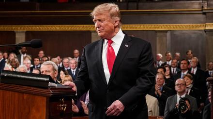 TOPSHOT - US President Donald Trump arrives to deliver the State of the Union address at the US Capitol in Washington, DC, on February 5, 2019. (Photo by Doug Mills / POOL / AFP)
