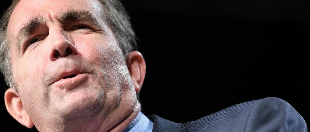 (FILES) In this file photo taken on October 19, 2017 Democratic Gubernatorial Candidate Ralph Northam speaks during a campaign rally in Richmond, Virginia. - How far do we go in holding politicians accountable for offensive behavior from their past?What if that behavior evoked the darkest chapters of American history, from slavery to segregation? (Photo by JIM WATSON / AFP) / TO GO WITH AFP STORY by Issam AHMED: "Racism and redemption: Virginia blackface row sparks national debate"