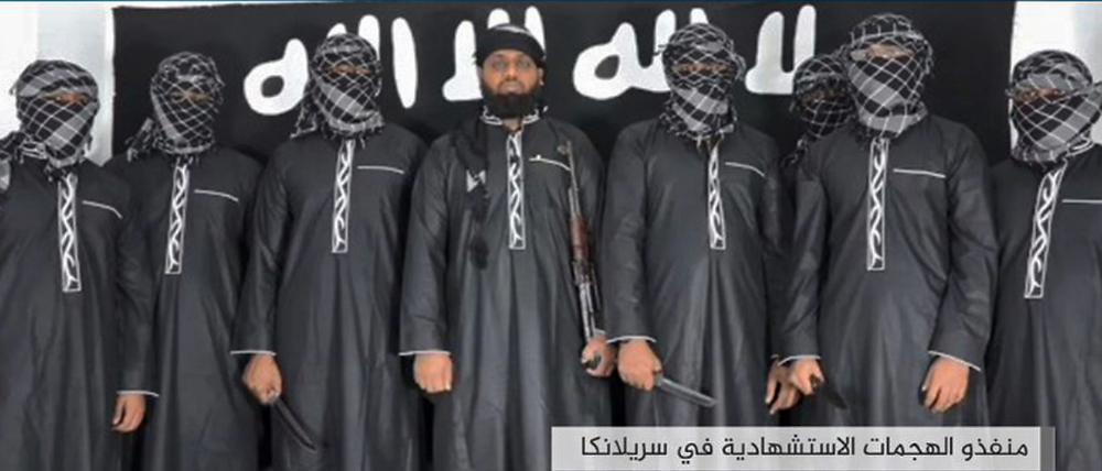 Das Foto, das die IS-nahe Medienplattform Amaq verbreitete, soll zumindest zum Teil die Attentäter der Anschläge von Sri Lanka zeigen.