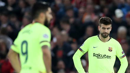Ratlos. Gerard Pique (rechts) und Luis Suarez erlebten in Liverpool einen der bittersten Abende ihrer Karrieren. 