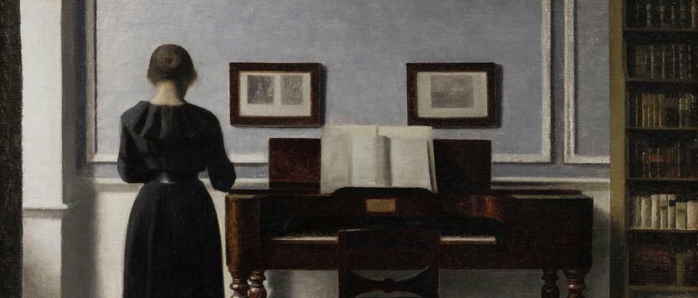 Vilhelm Hammershøis Interieur mit Klavier und Frau.