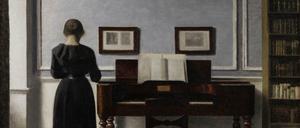 Vilhelm Hammershøis Interieur mit Klavier und Frau.