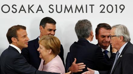 Frankreichs Präsident Emmanuel Macron, der spanische Premier Pedro Sanchez, Angela Merkel und EU-Kommisionschef Jean-Claude Juncker beim G20-Treffen in Osaka.