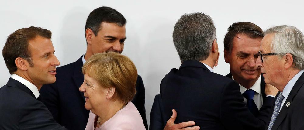 Frankreichs Präsident Emmanuel Macron, der spanische Premier Pedro Sanchez, Angela Merkel und EU-Kommisionschef Jean-Claude Juncker beim G20-Treffen in Osaka.
