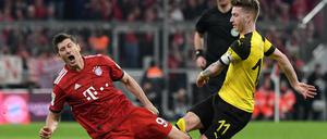 Beim Supercup am Samstag treffen Borussia Dortmund und der FC Bayern München aufeinander. Im Bild Münchens Robert Lewandowski (l) und Marco Reus aus Dortmund. 