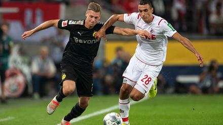 Enges Rennen. Der Kölner Ellyes Skhiri (r.) und Dortmunds Lukasz Piszczek lieferten sich mit ihren Mannschaften ein hart umkämpftes Duell.