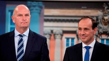 Top candidate of the conservative Christian Democratic Union (CDU) party, Ingo Senftleben (L) and Brandenburg's State Premier and top candidate of the social democratic SPD party Dietmar Woidke take part in a TV show at the German channel ARD following the results of the exit polls during the state elections in Brandenburg on September 1, 2019 in Potsdam, eastern Germany. - The far-right Alternative for Germany party surged strongly in elections in two eastern states, public television exit polls said, reflecting anger with Chancellor Angela Merkel's coalition government. In Saxony, the anti-immigration AfD scored 27.5 percent, up sharply from 9.7 percent five years ago, broadcasters ARD and ZDF forecast. (Photo by Christoph Soeder / POOL / AFP)