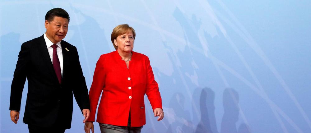Bundeskanzlerin Angela Merkel (CDU) und Chinas Präsident Xi Jinping auf einem Archivbild.