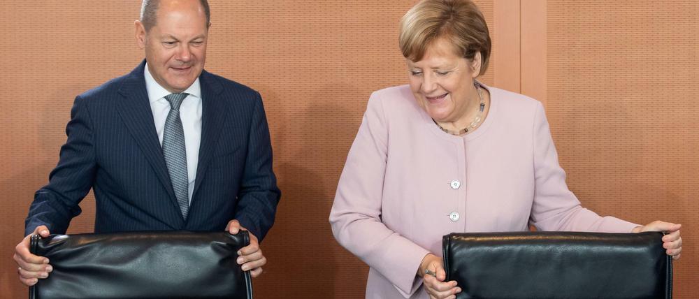 Kanzlerin Angela Merkel (CDU) und Finanzminister Olaf Scholz (SPD).