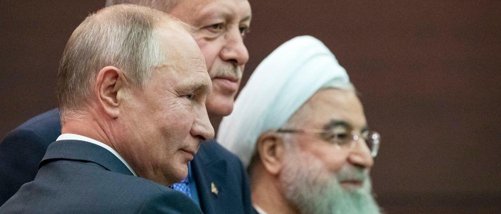 Die Präsidenten Russlands, der Türkei und des Iran, Putin, Erdogan und Ruhani, während ihres Treffens in Ankara.