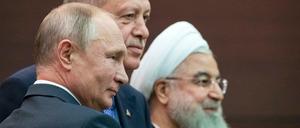Die Präsidenten Russlands, der Türkei und des Iran, Putin, Erdogan und Ruhani, während ihres Treffens in Ankara.