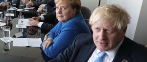 Von einander abgewandt: Boris Johnson und Angela Merkel.