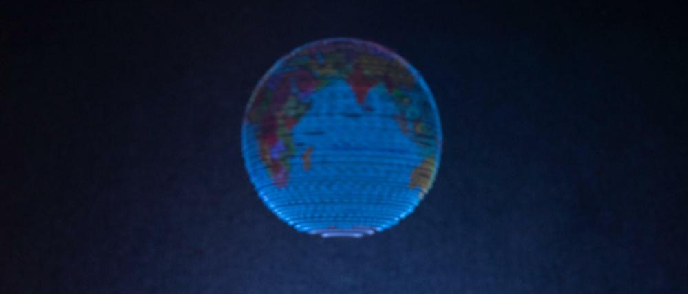 Mit einer neuartigen Hologramm-Technik haben Forscher der Universität Sussex einen - frei im Raum schwebenden - Globus dargestellt.